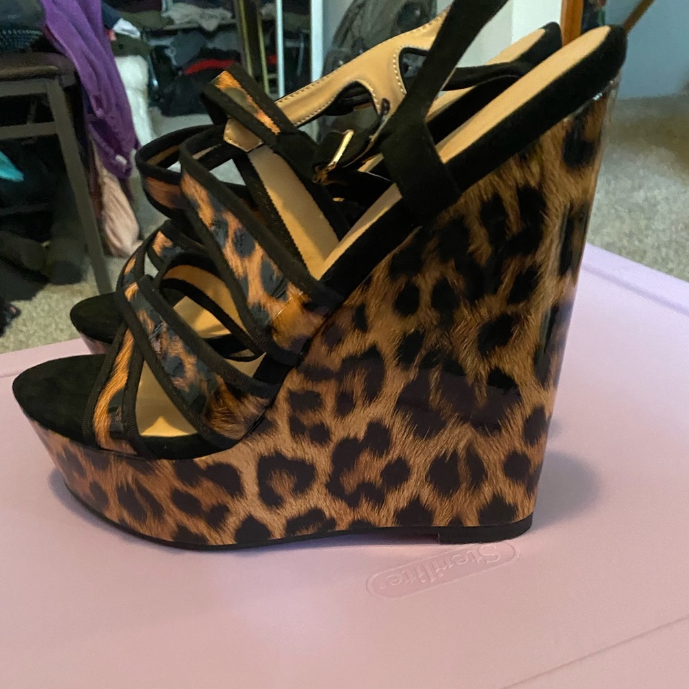 Women’s size 14 leopard print high heel wedges. Like new. Open toe. Buckles.